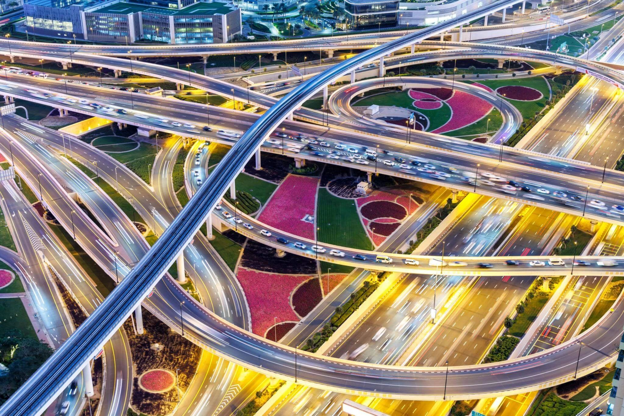 Dubai crossroads of Sheikh Zayed Road highway interchange traffic near Burj Khalif awith metro